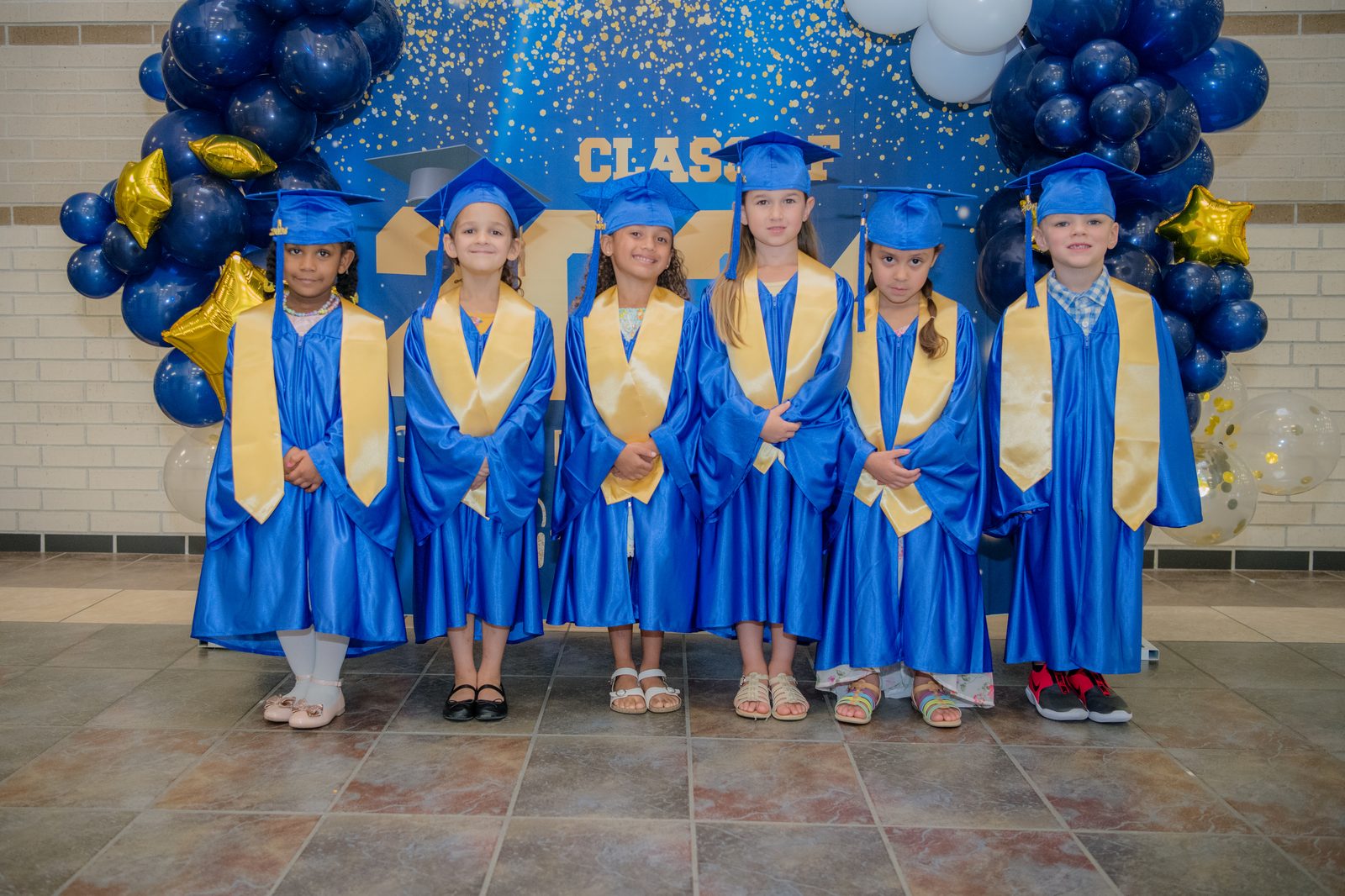 A happy group of MyPlace children together at graduation in Katy, TX