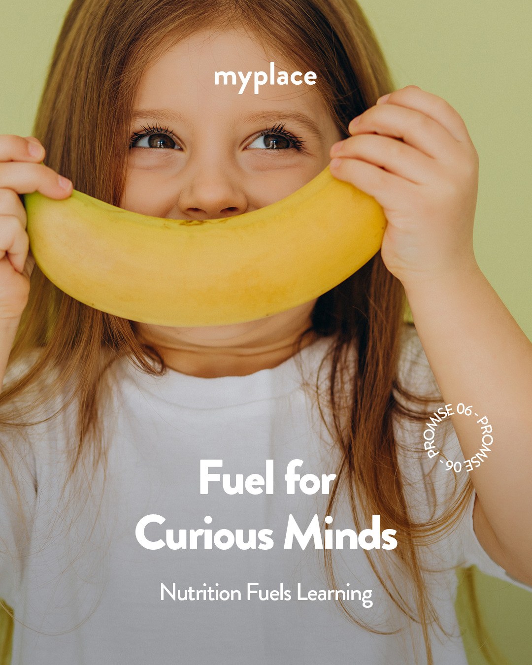 A young child holds a banana up like a smile — Fuel for Curious Minds, MyPlace Early Learning Center